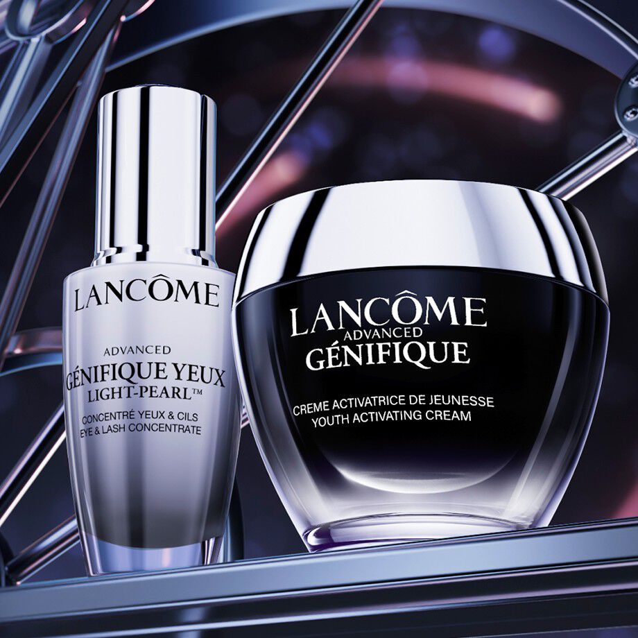 Lancome's Advanced Genfique Creme and Genifique Yeux Light-Pearl Serum displayed together on a neutral background.