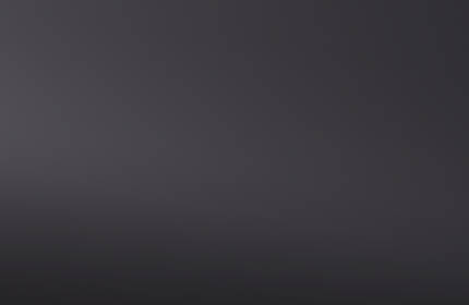 A collection of cosmetics featuring a black eyeliner, a bottle of foundation, and a red lipstick set against a sleek, dark background.